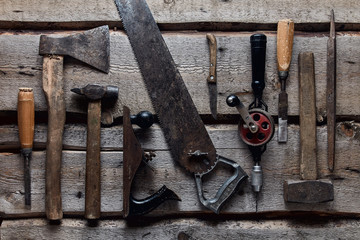 old carpentry tools on wooden background