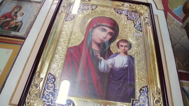icon in the orthodox church with the image of the mother of god and little jesus christ
