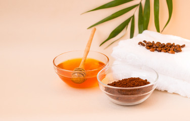 Spa care at home. Scrub of coffee and honey. Light background. Space for text. Horizontal photo. The view from the top.