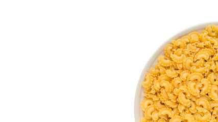 many dry unprepared pasta - cockerels on a round beige plate. Isolated on a white, copy space for text