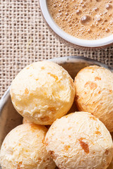 Brazilian cheese bread in a bowl. Wood background.