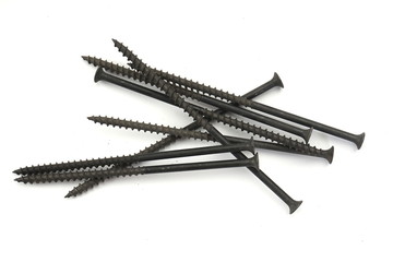 Metal screws, iron screws, wood screws isolated on white backgro
