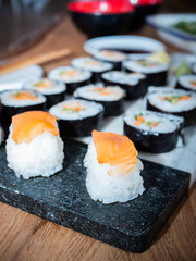 sushi on a plate/chopping board close up 