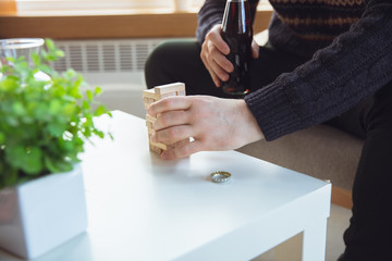 Portrait of millenial boy using retro toys, meeting things from the past and having fun. Generation of digital devices nostalgic for past entertainment. The memories of early childhood, again in trend