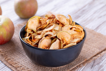 Dried apples in a bowl with apples
