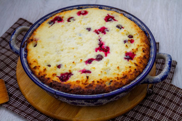 Cottage cheese casserole with cranberries. Baking cheesecake with cottage cheese and berries. Sweet cake with berries and cottage cheese.