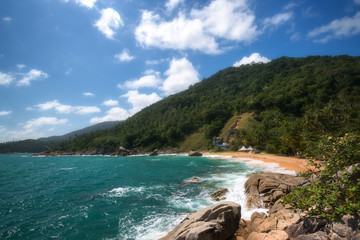 incredible beauty and the paradise secret beach of Haad Nam Tok with the azure sea and a rocky coast on the island of Ko Pha-ngan in Thailand