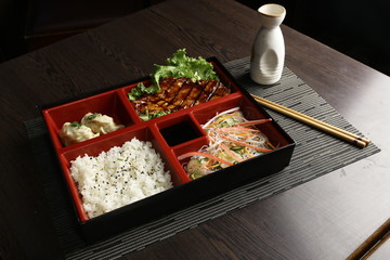 Grilled chicken teriyaki with asian rice, dumpling and oriental salad