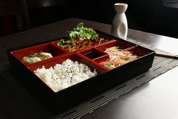 Grilled chicken teriyaki with asian rice, dumpling and oriental salad