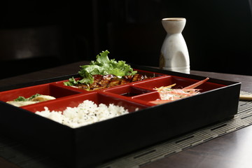 Grilled chicken teriyaki with asian rice, dumpling and oriental salad