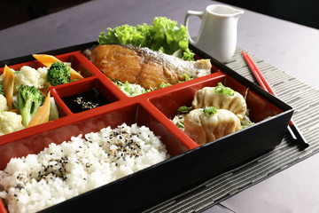 Grilled salmon, rice with black sesame, vegetables and dumpling 