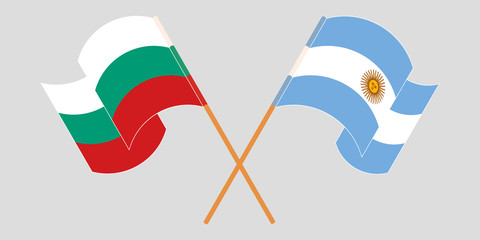 Crossed and waving flags of Bulgaria and Argentina