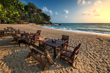Fototapeta na wymiar .incredible beauty and paradise Haad Than Sadet Beach with azure sea and golden sand on the island of Ko Pha-ngan in Thailand with a fabulous hilltop village and cafe on the beach