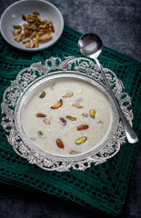 Kheer or Payasam is a type of rice pudding from the Indian subcontinent, made by boiling milk and sugar and is flavoured with dry fruits and nuts, served in decorative plate.