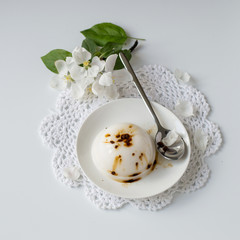 Sweet dessert.  Homemade vanilla pudding with chocolate on a small dessert plate. Selective focus.