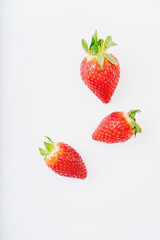 Fresh juicy strawberries isolated over white blackground