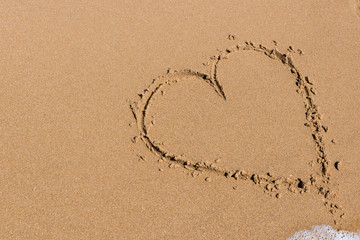 Heart draw on the shore of the sea