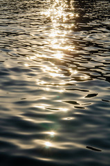 Seascape background sun's rays reflect on sea surface at sunset