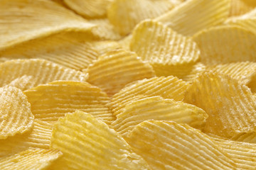 Image of sliced potato chips. Bunch of crisps. Closeup. Background. 