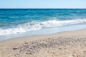 Seascape background colorful sea waves on sandy beach