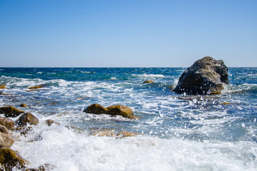 Seascape storm on wild rocky seashore