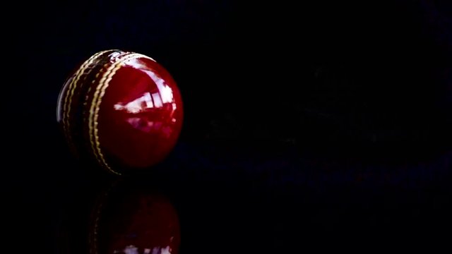 Cricket ball rotate on black background