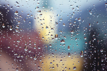 Rain drops on window glass , spring rainy day