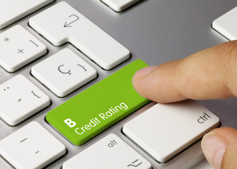 B Credit rating - Inscription on Green Keyboard Key.