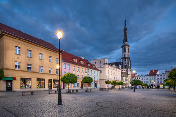 Zabkowice Slaskie, Poland. View of market square at dusk with old colorful houses and building of historic Town Hall