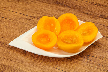 Marinated peaches fruit in the bowl