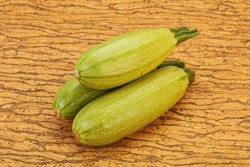 Young tasty zucchini over board