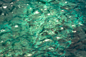 aquamarine seawater, transparent, glowing water, background, texture or abstraction