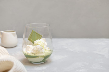 Matcha affogato with vanilla ice cream, matcha tea and decorated with matcha chocolate