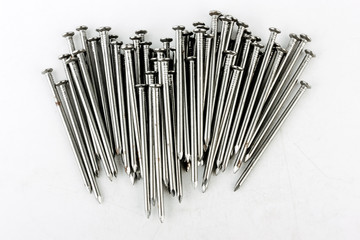 steel screws, metal screw, iron screw, screws as a background, wood screw. Iron or metal screw nails stack industrial building industry background.