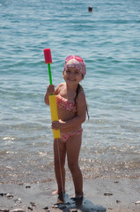 girl with a squirt gun on the sea