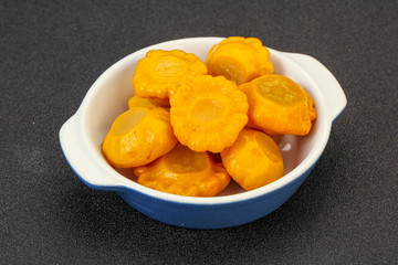 Marinated yellow patisson in the bowl