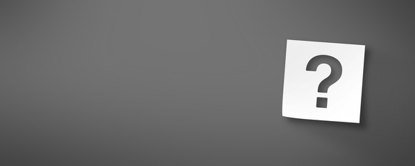 メモ用紙に切り抜いたクエスチョンマーク