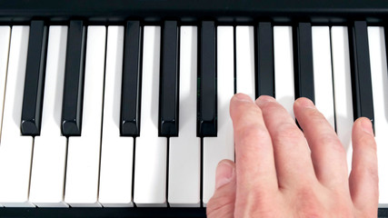The pianist, hand playing a piano. Music.