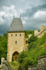Fototapeta na wymiar Tower with gate of Royal castle of Karlstejn, Czech Republic