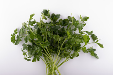fresh bunch of parsley closeup on a white background