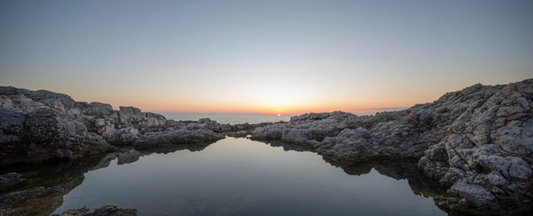 Sunset on a rocky beach