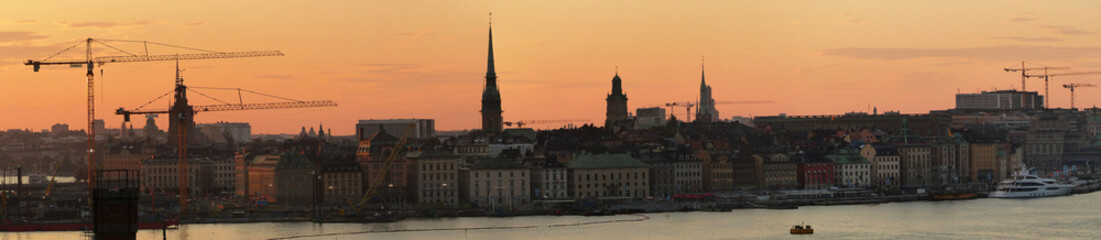 Fototapeta na wymiar Panoramic sunset view over the old town of Stockholm from the Fjällgatan view point