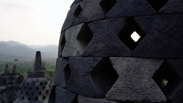 sun shining through stupa at borobudur