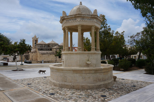 Upper Fountain of Geroskipou, ancient Byzantine church of Agia Paraskevi in background. Yeroskipou, Cyprus.