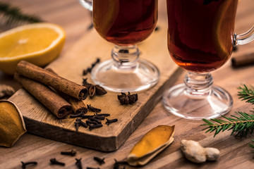 mulled wine with spices on a wooden table