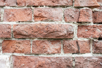old grunge brick wall close up horizontal layout lofty broken red bricks with even light and no deep shadows,destroyed brick texture background