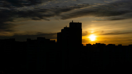 Sunset on the background of the night city.