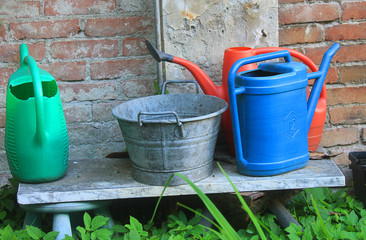 buckets and watering cans in the garden