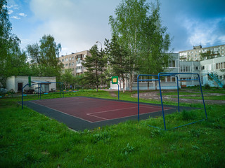 Sports ground in courtyard of residential complex. Public sports grounds for team games of sport,...