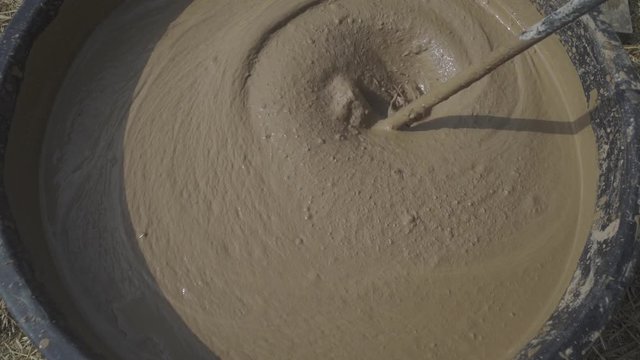 This is the process of mixing the mortar for plaster.